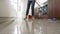 Time Lapse Sequence Of Woman Mopping Kitchen Floor