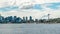 Time lapse shot of flowing water with boats and ships near the skyline of Seattle