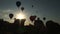 Time lapse of silhouette of balloon going into the sky