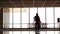 Time lapse silhouette people walking in airport. Silhouettes of crowd of backlighted people walking