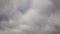 Time lapse sky with amorphous gray nimbostratus clouds blow from left to right
