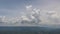 Time lapse sky and clouds with mountain on the bottom.