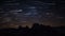 Time lapse with star trails of milky way and night sky with stars over Dolomite Alps at Three Peaks in summer, South Tyrol Italy