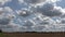 Time lapse of stunning dramatic clouds over a corn field