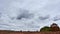 Time lapse of stunning dramatic clouds over a field