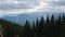 time-lapse of sunbeams emerging through dark storm clouds in the mountains above the Montenegrin ridge in the