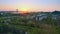 Time-lapse of sunrise in city suburban area. Flare sunlight