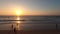 Time lapse sunset over the beach. People walking swimming and rowing kayaking, Tel Aviv, Israel. High-quality 4k footage