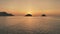 Time-lapse of sunset seascape at mountain island silhouette aerial. Nobody nature landscape