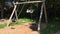 Time lapse of the swings swing without a child in an accelerated form