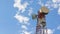 Time lapse telecommunication tower and clouds