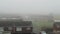 Time lapse of thick morning scattering fog over rooftops of London's private sector. Haze disappears andspace above