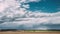 Time lapse time-lapse timelapse of countryside rural field spring meadow landscape under scenic dramatic sky before and