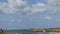 Time lapse to the sea 4k in Civitavecchia with clouds. Freight ships anchored offshore. The sky with clouds at the sea.