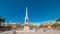 Time lapse of tourists visiting the memorial obelisk dedicated to General Torrijos in Plaza de la Merced