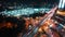 Time-lapse of under construction site, car traffic transportation on road in downtown Asia at night