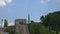 Time lapse of unidentifiable tourists climbing stairs on the medieval fortress wall, known in Catalan as Passeig de la