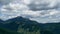 Time lapse video of green forest, aerial view of summer forest and moving clouds