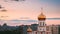 Time-lapse View On Church At Dusk Time. Soft Colors Sky Background. From Day To Evening Transition. Bold Bright Yellow