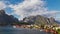 Time lapse view of Reine fishing village with mountain range in the background