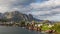 Time lapse view of Reine fishing village with mountain range in the background