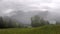 Time lapse of the view of Zell am See and the Zeller See that looms through the rising fog.