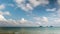 Time-lapse of viewpoint with cumulus and cirrus clouds forming above tropical islands