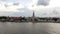 Time lapse of Wat Arun temple or with moving clouds and sun rays, water transport of Chao Phraya River