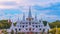 Time lapse of white Buddhist Pagoda with multiple spires at Wat Asokaram Temple in Samutprakan province, Thailand