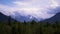 Time lapse of wickedly intense clouds roiling and flowing over peaks