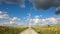 Time lapse of wind turbine white fluffy  clouds