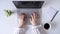 Time lapse. Woman worker cleaning laptop using antivirus wet wipe. type keyboard sitting in an office table with cup of coffee and