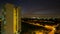 Time lapse zooming out movie of sunset and Traffic Light Trails from Eunos apartment building in Singapore 1080p