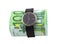 Time is money. Watch and 100 euro bills on white