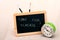 Time for school blackboard and old table clock