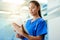 Time for a second opinion. Shot of a young nurse using a tablet while standing inside a clinic.