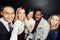 Time for a selfie of the best team. Portrait of a group of businesspeople taking a selfie against a dark background.