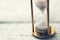 Time is ticking - hourglass on the table with copy space