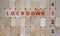 Time to 3rd lockdown. Wooden blocks form the words `lockdown 3`. Numbers 1, 2, 4. Beautiful wooden background. Covid-19 pandemic