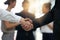 Time to achieve greatness together. Closeup shot of businesspeople shaking hands in an office.