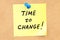 Time to Change. Text on a sticky note pinned to a corkboard. 3D