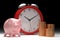 Time to earn and pay metaphor - pink piggy bank and gold coins