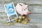 Time to invest your savings concept with pile of money , alarm clock and piggy bank