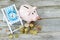 Time to invest your savings concept with pile of money , alarm clock and piggy bank