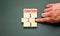 Time to iteration 2 symbol. Concept word Iteration 1 2 3 on wooden block. Businessman hand. Beautiful grey table grey background.