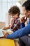 Time to learn. Curious little latin school boy doing homework together with his father, writing on the paper while