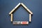 Time to rent house symbol. Concept words `Time to rent` on wooden blocks near miniature house. Beautiful grey background, copy