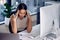 Time to take a break. a female call center worker experiencing a headache at work.