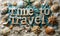 Time to Travel spelled out in block letters surrounded by colorful seashells and a green starfish evoking thoughts of beach