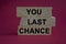 Time to your last chance symbol. Concept words Your last chance on brick blocks on a beautiful red background. Business and your